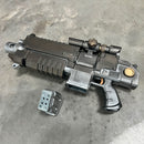 Toy gun with detailed design on a concrete surface